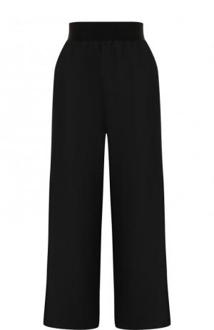 Однотонные расклешенные брюки из шерсти Maison Margiela. Цвет: черный