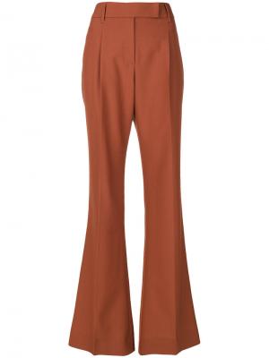 Длинные брюки клеш Prada. Цвет: жёлтый и оранжевый