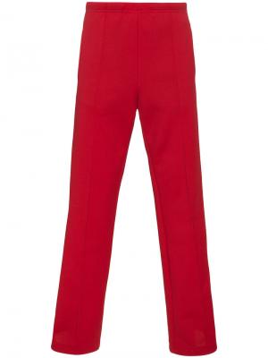 Спортивные брюки с полоской по бокам Maison Margiela. Цвет: красный